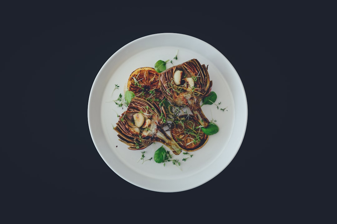 Artichoke dish plated on a round white plate